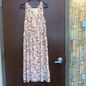 Women’s tea length sleeveless flowered dress